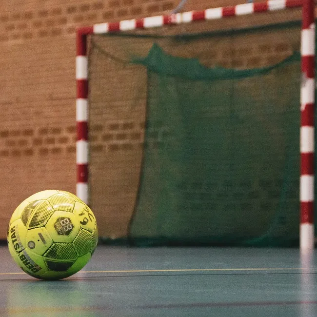 yellow and black soccer ball on field-otuM-nw-_NY-unsplash  pascal-swier 650.jpg