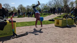 Boy doing handstand on a slackline